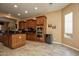Well-equipped kitchen with stainless steel appliances, granite countertops, and tile flooring at 26293 W Runion Ln, Buckeye, AZ 85396