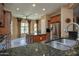 Spacious kitchen with stainless steel appliances, granite counters, and a central island at 26293 W Runion Ln, Buckeye, AZ 85396