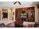 Living room featuring built-in shelving, a ceiling fan, and recessed lighting at 26293 W Runion Ln, Buckeye, AZ 85396