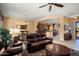 Open-concept living room featuring a comfortable sofa, dining table, and views of the kitchen at 26293 W Runion Ln, Buckeye, AZ 85396