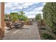 Inviting outdoor patio featuring comfortable seating around a fire pit and decorative landscaping at 26293 W Runion Ln, Buckeye, AZ 85396