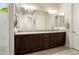 Elegant bathroom featuring double sinks, granite counters, and modern fixtures at 26797 W Sierra Pinta Dr, Buckeye, AZ 85396