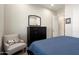 Cozy bedroom featuring stylish armchair and dresser at 26797 W Sierra Pinta Dr, Buckeye, AZ 85396