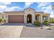 Charming single-story home featuring a well-manicured yard and a welcoming covered entrance at 26797 W Sierra Pinta Dr, Buckeye, AZ 85396