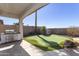 Outdoor space features a putting green and a built-in grill, perfect for relaxation and entertaining at 2813 W Hiddenview Dr, Phoenix, AZ 85045