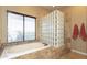 Bathroom featuring a large soaking tub and a glass block shower at 2813 W Hiddenview Dr, Phoenix, AZ 85045