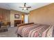 Comfortable bedroom with neutral walls, and bright windows, featuring a ceiling fan and carpet at 2813 W Hiddenview Dr, Phoenix, AZ 85045