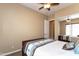 Bedroom featuring a ceiling fan, neutral carpet, and a partial view of the bed at 2813 W Hiddenview Dr, Phoenix, AZ 85045