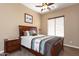 Bedroom featuring a wooden headboard and ceiling fan at 2813 W Hiddenview Dr, Phoenix, AZ 85045