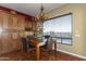 Dining table sits in the naturally lit space, next to kitchen cabinets at 2813 W Hiddenview Dr, Phoenix, AZ 85045