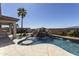 Resort-style pool with a waterfall, built-in seating, and putting green in backyard at 2813 W Hiddenview Dr, Phoenix, AZ 85045