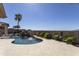 Stunning outdoor pool with waterfall feature, palm trees, and desert landscaping at 2813 W Hiddenview Dr, Phoenix, AZ 85045