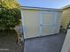 Outdoor storage shed with a door, offering additional space for tools and equipment at 3160 E Main St # 62, Mesa, AZ 85213