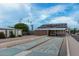 Outdoor shuffleboard courts offer a fun recreational activity in a sunny community setting with ample parking and green landscaping at 3160 E Main St # 62, Mesa, AZ 85213