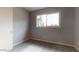 Bedroom features neutral walls, carpeted floors, and a window providing ample light at 4216 W Solano Dr, Phoenix, AZ 85019