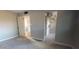 Carpeted bedroom with neutral walls and a closet visible through an open door at 4216 W Solano Dr, Phoenix, AZ 85019