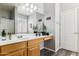 A stylish bathroom vanity with wood cabinets, a spacious countertop, and modern fixtures at 4308 E Smokehouse Trl, Cave Creek, AZ 85331