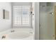 Relaxing bathroom showcasing a soaking tub beneath a window, complemented by a glass-enclosed shower at 4308 E Smokehouse Trl, Cave Creek, AZ 85331