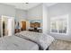 Bright bedroom with a vaulted ceiling, cozy carpet, and a mounted television for entertainment at 4308 E Smokehouse Trl, Cave Creek, AZ 85331