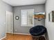 Cozy bedroom with hardwood floors, plantation shutters, and an entertainment area with a wall-mounted TV at 4308 E Smokehouse Trl, Cave Creek, AZ 85331