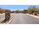 Community entrance featuring a stone column and gate providing secure entry to the neighborhood at 4308 E Smokehouse Trl, Cave Creek, AZ 85331