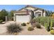 Charming home exterior featuring well-maintained desert landscaping with mature cacti at 4308 E Smokehouse Trl, Cave Creek, AZ 85331