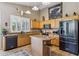 Well-equipped kitchen featuring stainless steel appliances, an island and warm wood cabinetry at 4308 E Smokehouse Trl, Cave Creek, AZ 85331