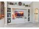 Cozy living room featuring a built-in entertainment center and neutral colored walls at 4308 E Smokehouse Trl, Cave Creek, AZ 85331