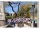 Cozy outdoor living space with comfortable seating, a fireplace, and built-in grill at 4308 E Smokehouse Trl, Cave Creek, AZ 85331