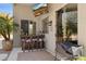 Relaxing outdoor patio features a built-in bar, bar stools, and wall-mounted TV at 4308 E Smokehouse Trl, Cave Creek, AZ 85331