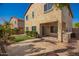 A two-story home showcasing an inviting backyard with a built-in grill and a fire pit at 4617 S Carmine --, Mesa, AZ 85212