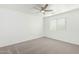 Bedroom featuring plush carpet, a modern ceiling fan, and lots of natural light at 4617 S Carmine --, Mesa, AZ 85212