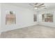 Bright bedroom featuring neutral tile flooring, white walls, and a ceiling fan at 4617 S Carmine --, Mesa, AZ 85212