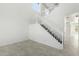 Bright entryway featuring neutral tile flooring, white walls, and a staircase at 4617 S Carmine --, Mesa, AZ 85212