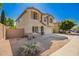 Tan two-story home featuring desert landscaping and a driveway at 4617 S Carmine --, Mesa, AZ 85212