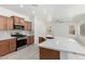 This kitchen features wooden cabinets, stainless appliances, marble countertops, and an island at 4617 S Carmine --, Mesa, AZ 85212