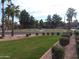 Tennis courts surrounded by well-manicured landscaping and mature trees at 4816 E Corral Rd # 2, Phoenix, AZ 85044