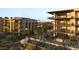 Stunning shot of condos with desert landscaping, balconies, and mountain views at 4849 N Camelback Ridge Rd # A106, Scottsdale, AZ 85251