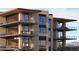 Modern multi-story apartment building featuring private balconies with seating and sleek architectural design at 4849 N Camelback Ridge Rd # A106, Scottsdale, AZ 85251