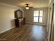 Cozy bedroom with wood floors, a dresser, a window, and closet space at 5132 N 31St Way # 127, Phoenix, AZ 85016