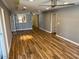 Bright living room features beautiful wood flooring and a ceiling fan at 5132 N 31St Way # 127, Phoenix, AZ 85016