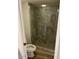 Tiled shower features seamless glass door, modern fixtures, and neutral color palette at 5132 N 31St Way # 127, Phoenix, AZ 85016