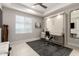 A bright bedroom featuring a Murphy bed that can be used as a work space with a desk and chair at 5250 E Deer Valley Dr # 146, Phoenix, AZ 85054