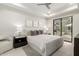 Serene bedroom with neutral tones, a sliding door, and a ceiling fan at 5250 E Deer Valley Dr # 146, Phoenix, AZ 85054