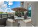 An inviting patio space with comfortable seating, a coffee table, and a partial view of the neighborhood at 5250 E Deer Valley Dr # 146, Phoenix, AZ 85054