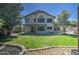 Expansive backyard featuring green lawn, privacy fence, and patio area at 5618 W Blackhawk Dr, Glendale, AZ 85308