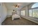 Spacious bedroom with natural light from the large windows at 5618 W Blackhawk Dr, Glendale, AZ 85308