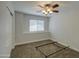 Empty bedroom shows a neutral color, natural light, and carpeted floor at 5618 W Blackhawk Dr, Glendale, AZ 85308