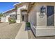 Front door view of home featuring stone landscaping, an exterior light fixture and address for a welcoming entrance at 5618 W Blackhawk Dr, Glendale, AZ 85308