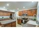 Bright kitchen featuring stainless steel appliances, granite countertops, and ample cabinet space at 5618 W Blackhawk Dr, Glendale, AZ 85308